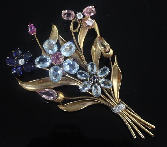 A large yellow metal and multi gem set floral spray trembleuse brooch, 11cm